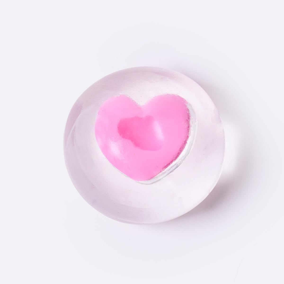 Pink heart squishy inside clear sticky ice cube