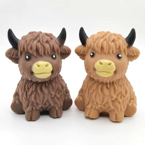 Two brown and caramel fluffy highland cow squishies