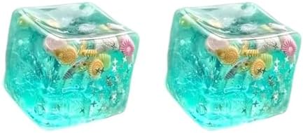 Two teal ocean glitter star squishy ice cubes with seashells
