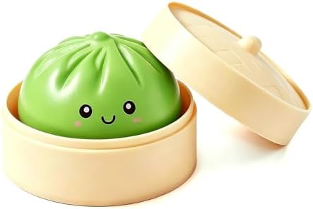 Green smiley dumpling squishy in a bamboo steamer basket