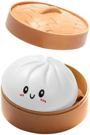 White dumpling squishy bao bun in a bamboo steamer with lid