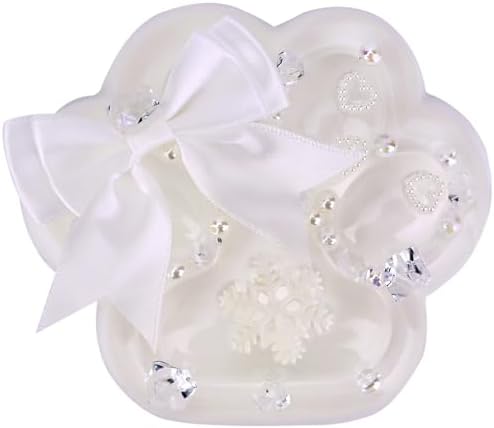 White cat squishy paw with satin bow and snowflake, slow rising fidget toy