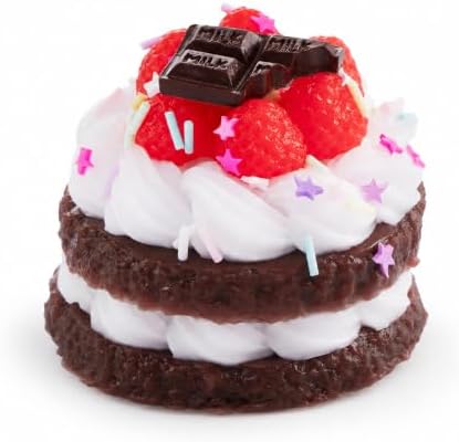 Raspberry chocolate layer cake squishy with cream and berries