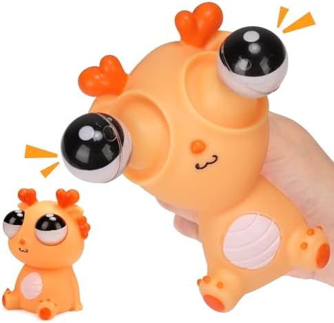 Orange pop-out eyeball squishy dragon squeeze toy in hand