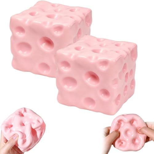 Two pastel pink cheese squishy cubes