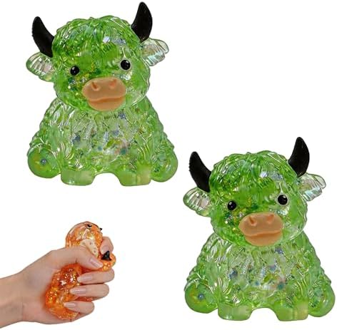 Two green crystal jelly highland cow squishies