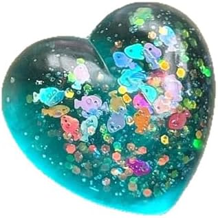 Teal glitter heart squishy with floating fish confetti