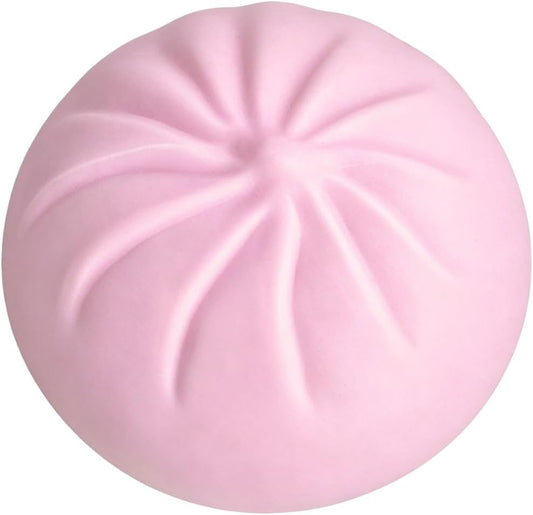 Soft pink pleated dumpling squishy bun on a white background