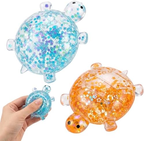 Two glitter turtle squishy stress balls in blue and orange