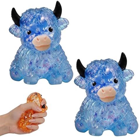 Two blue crystal bead highland cow squishies