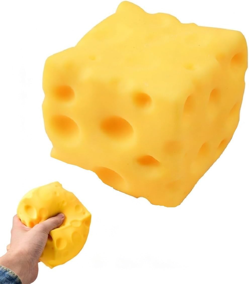 Soft yellow cheese squishy cube on a white background