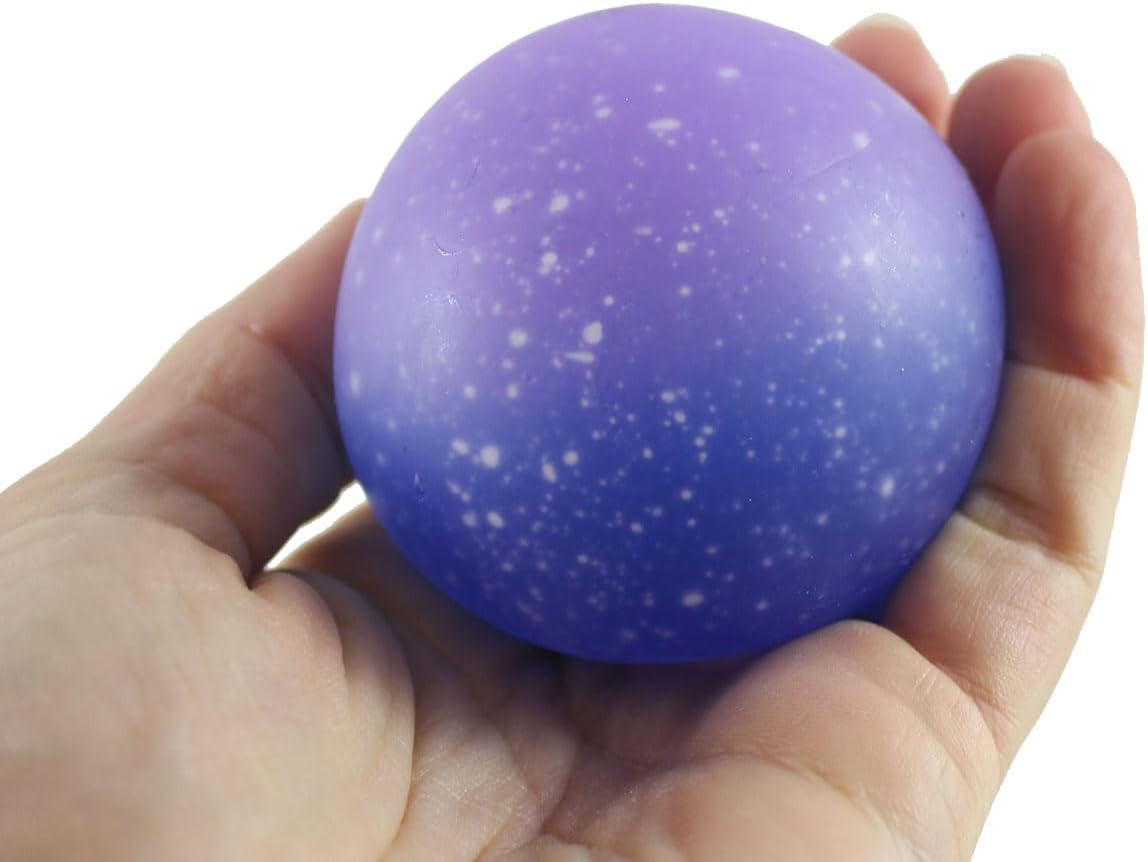 Jumbo purple galaxy squishy ball moldable gel toy in hand
