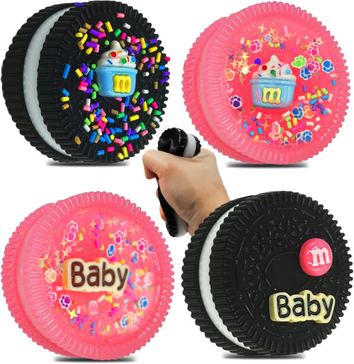Four mini black and pink mochi cookie squishies with sprinkles and candy toppings