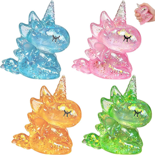 Four glitter unicorn squishy slow rising sensory toys in blue pink orange and green