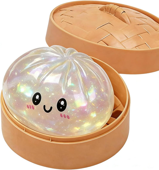 Iridescent pearly glitter dumpling squishy in a steamer basket