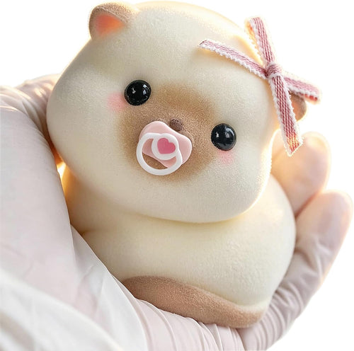 Cream flocked baby mochi squishy holding a pacifier with a gingham bow