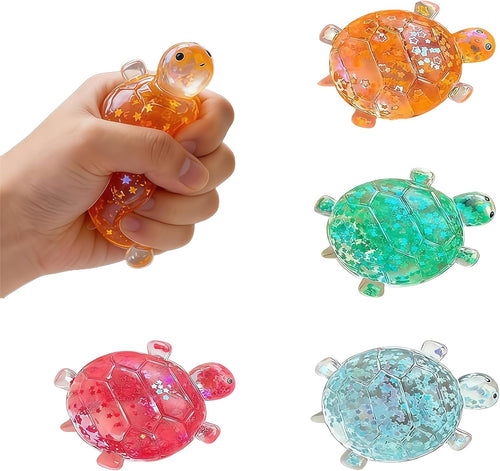 Set of four glitter turtle squishies in orange, green, blue and red
