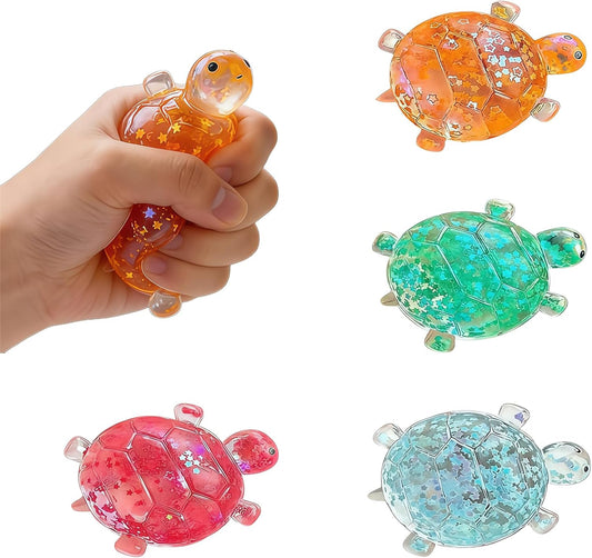 Set of four glitter turtle squishies in orange, green, blue and red