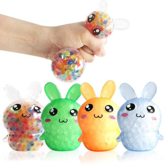 Four water bead bunny squishies in orange green blue and confetti
