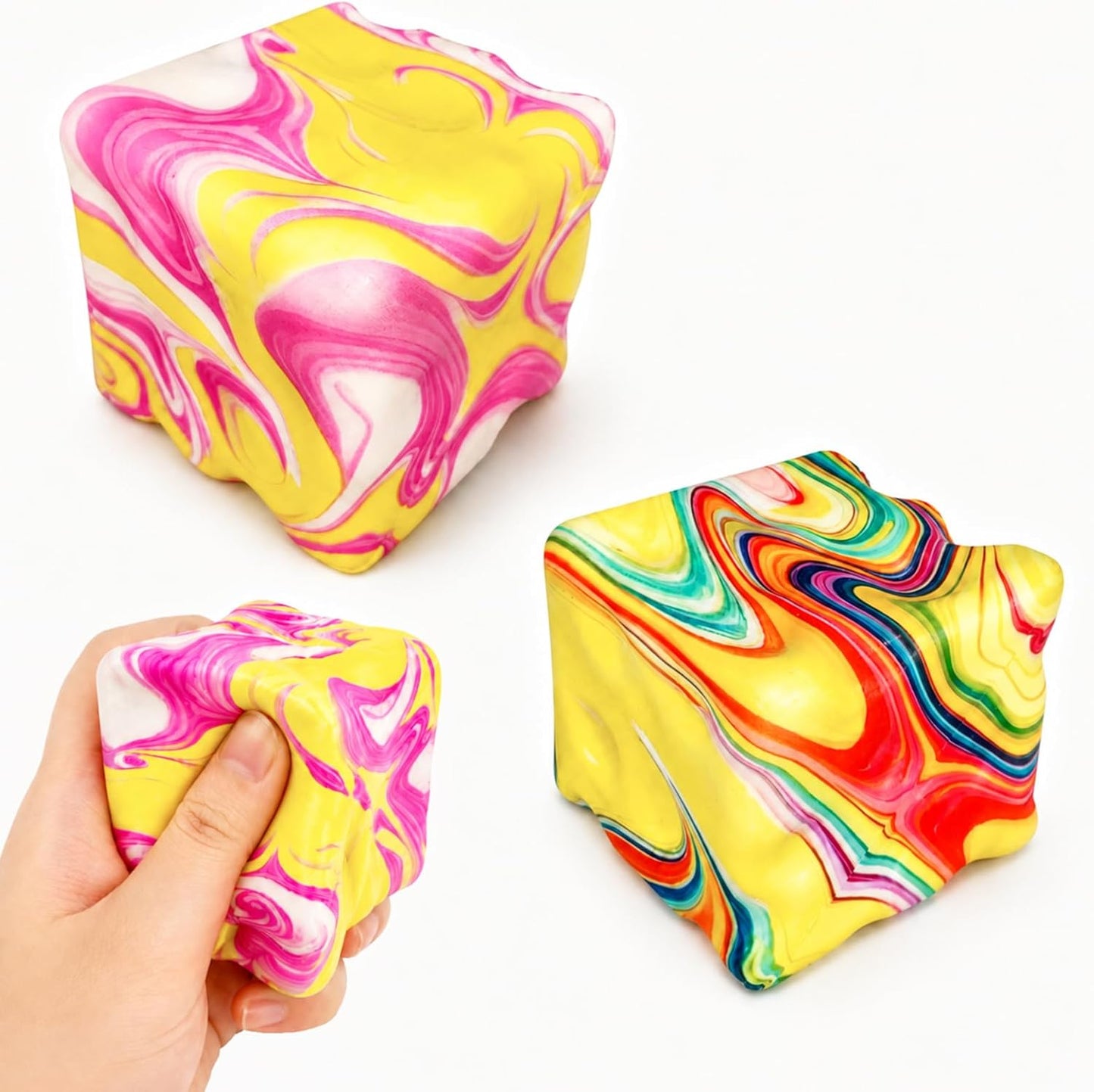 Two rainbow marbled cheese squishy cubes on white background