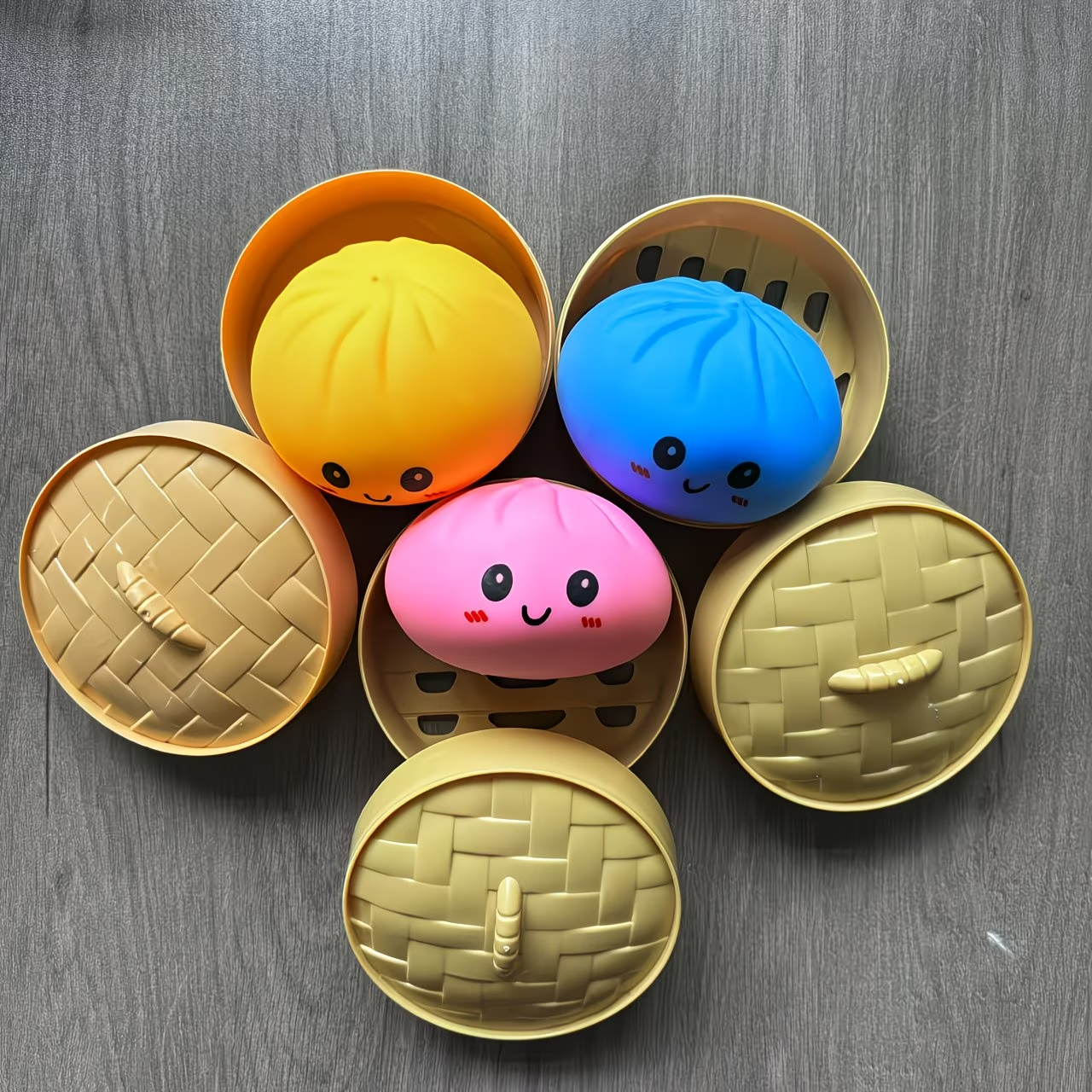 Baozi bun squishy stress balls in bamboo steamer cups, assorted colors