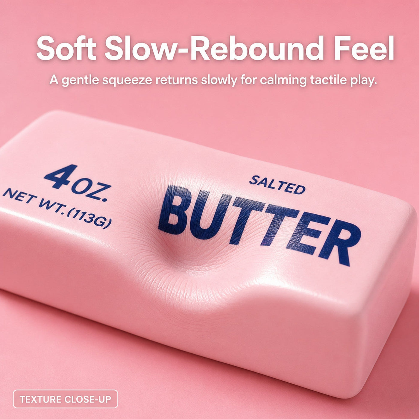Close-up of the pink butter squishy being pressed, showing its soft slow-rebound texture