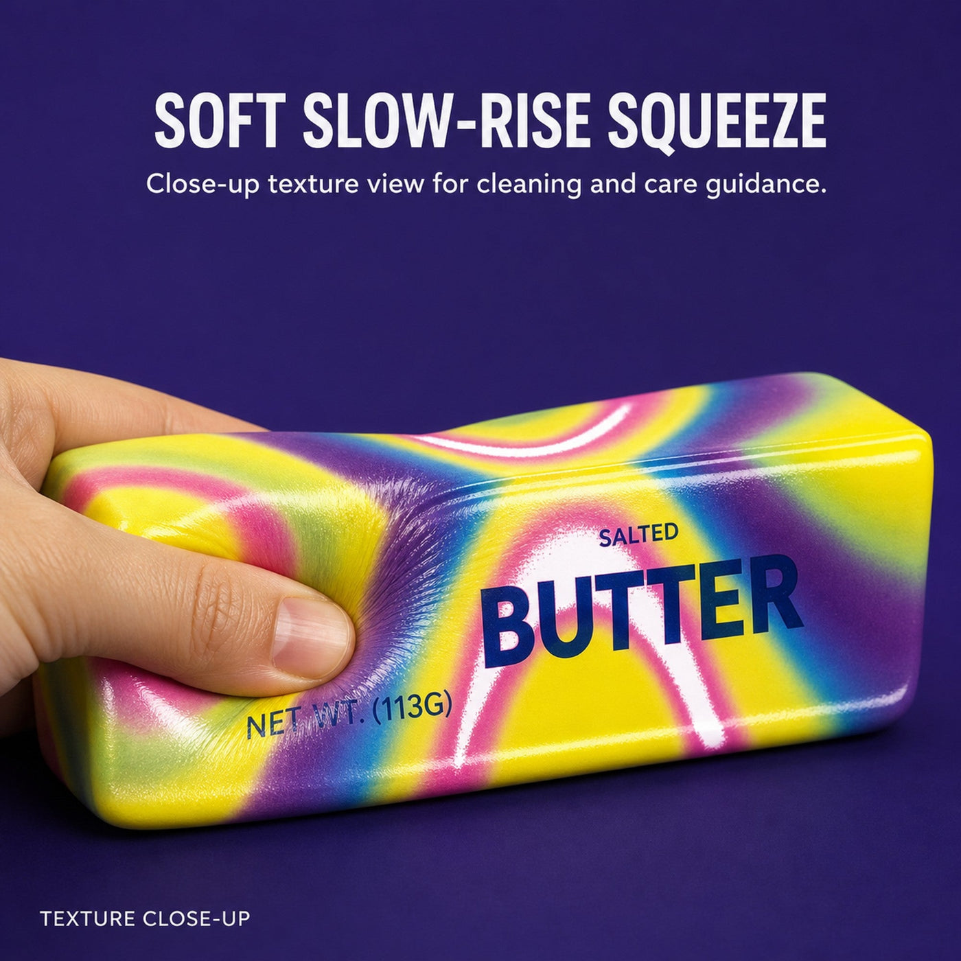 Close-up of a hand squeezing the soft slow-rise butter squishy, showing its squishy texture
