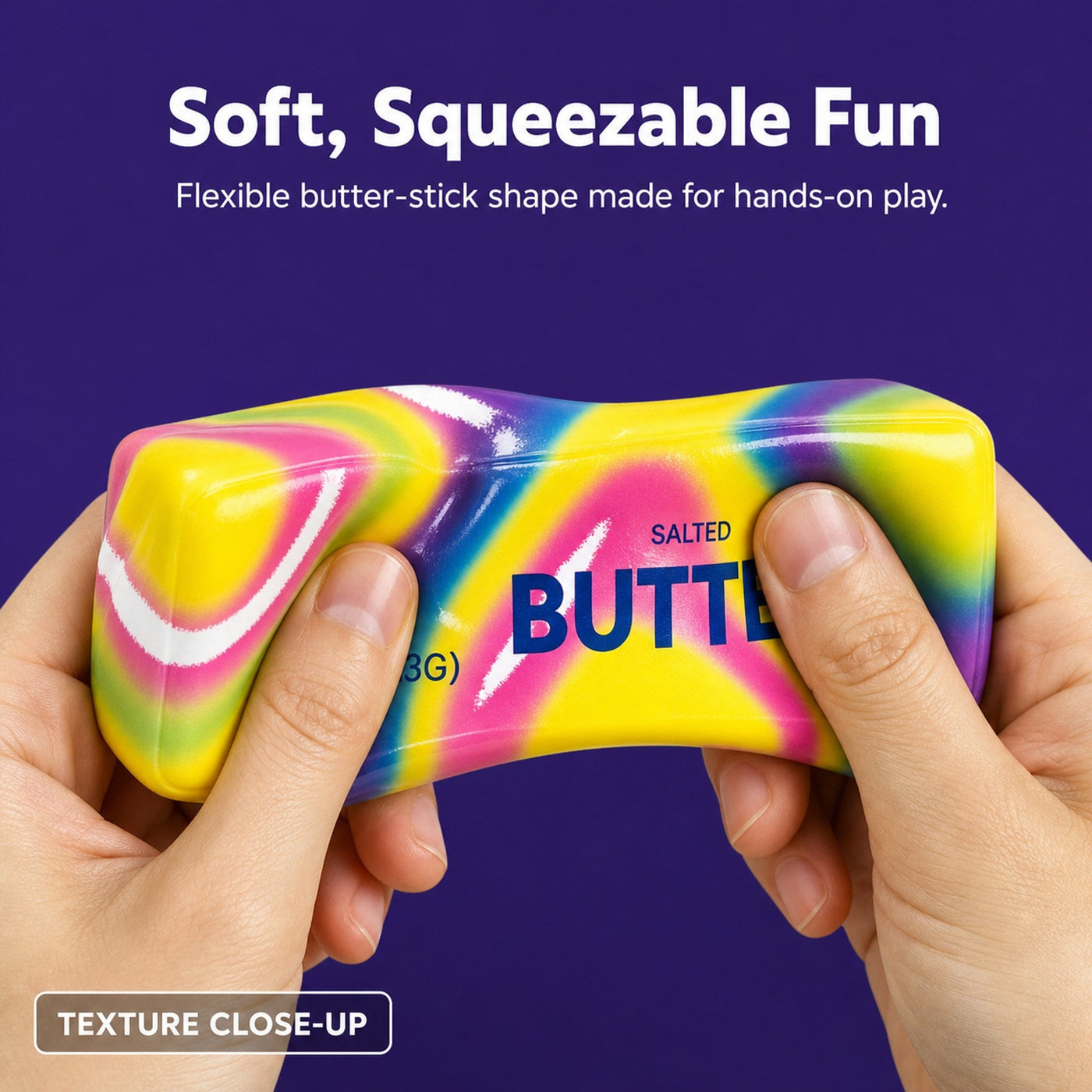 Hands squeezing a soft rainbow butter-stick squishy to show its flexible, stretchy texture in close-up