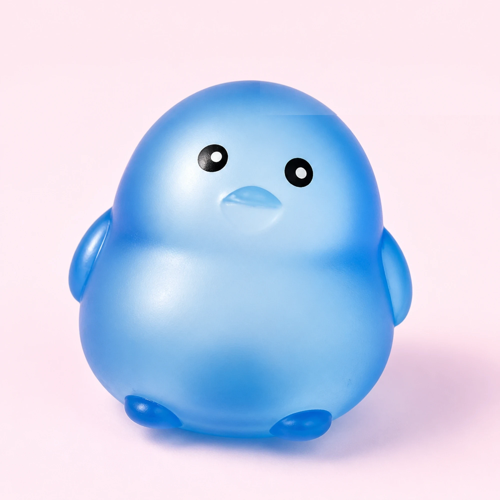 Blue chick squishy ball on a pale pink background