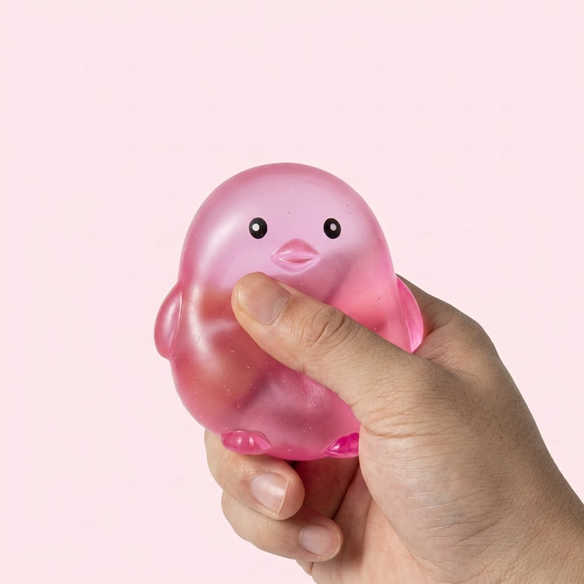 Pink chick squishy ball on a pale pink background