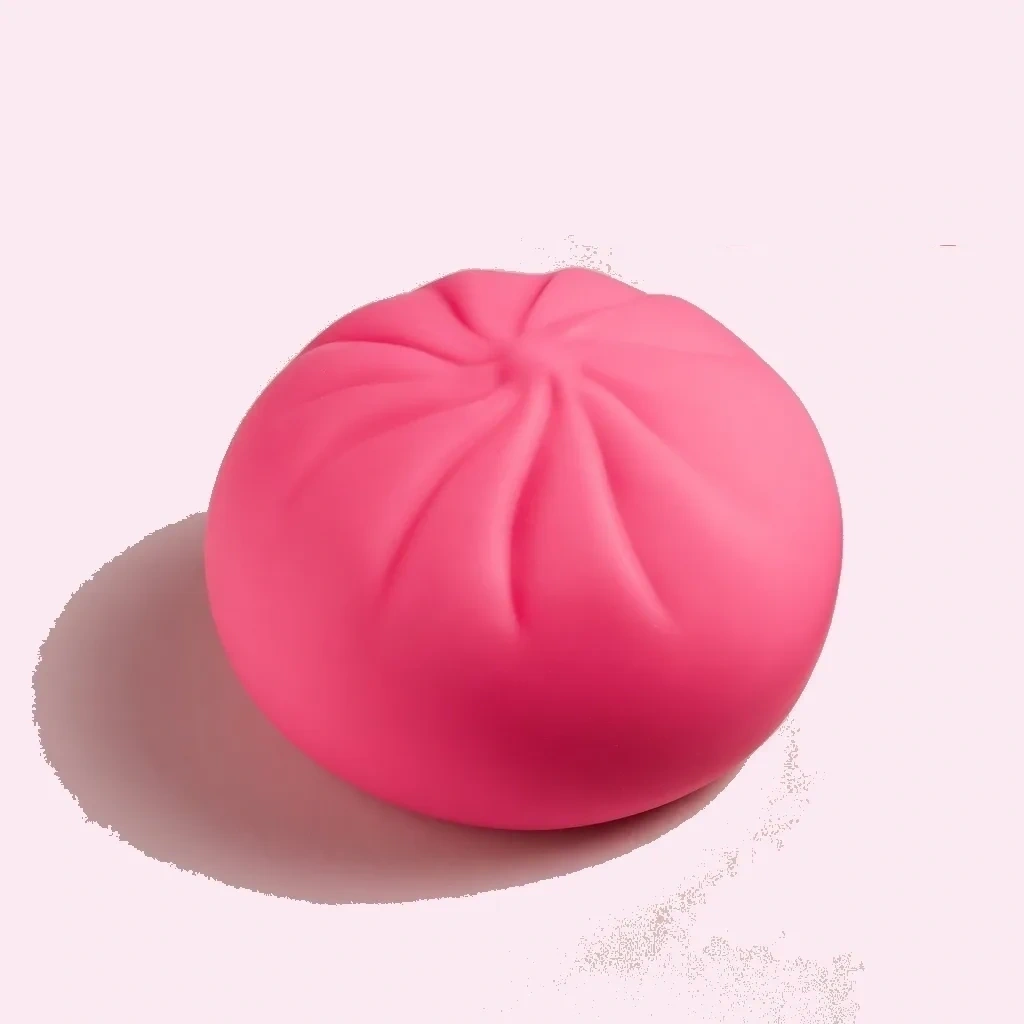 Rose-pink mini dumpling squishy shaped like a bao bun