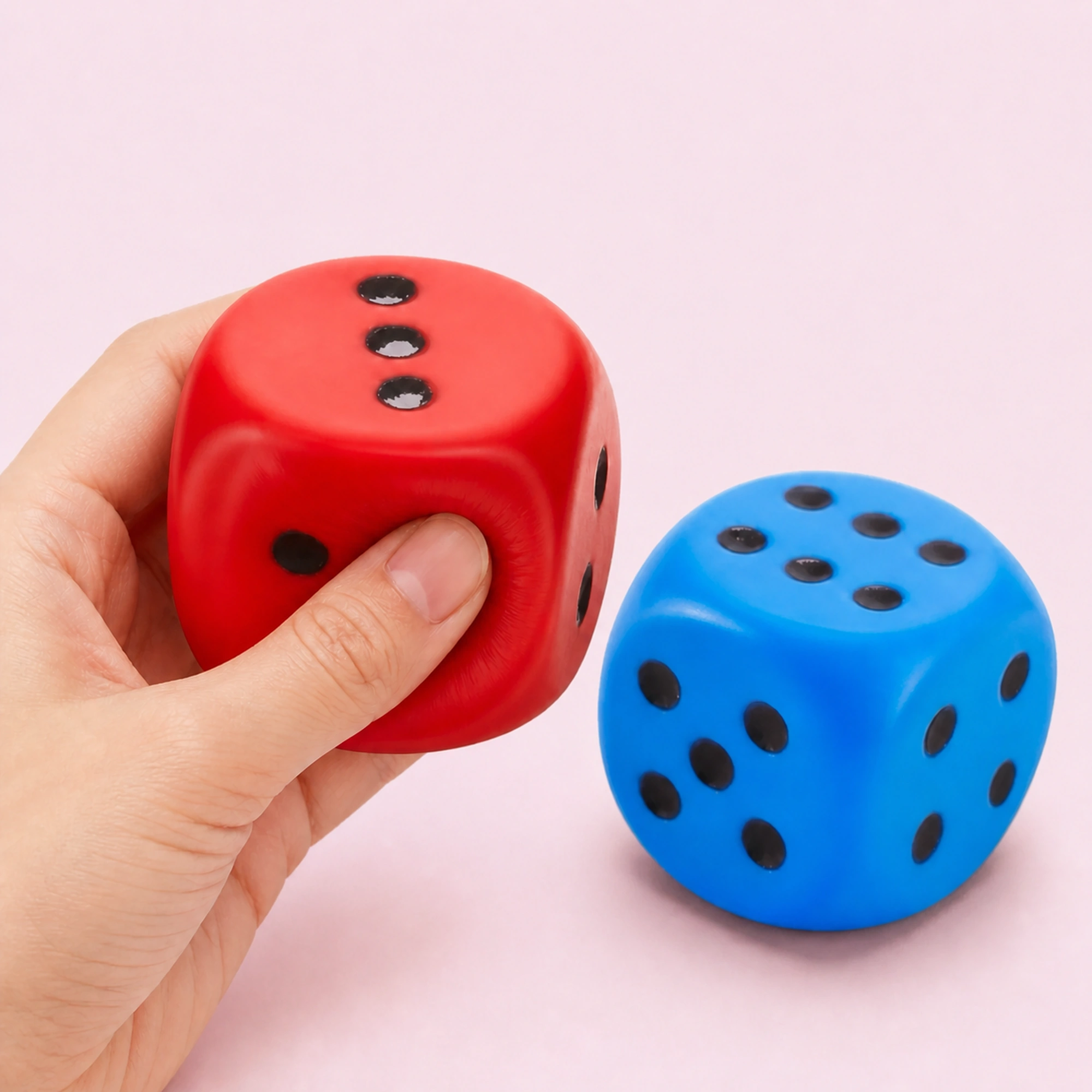 Large red and blue dice squishy — desk companion scene