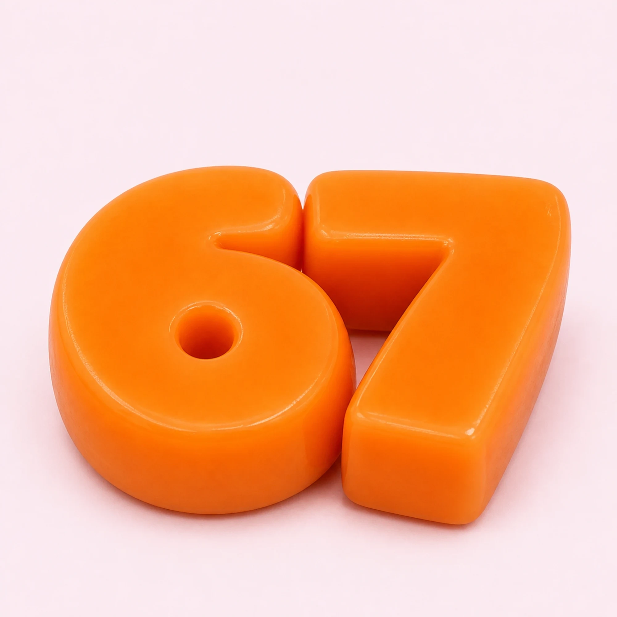 Orange soft solid 67 number squishy pair main image on pale pink background