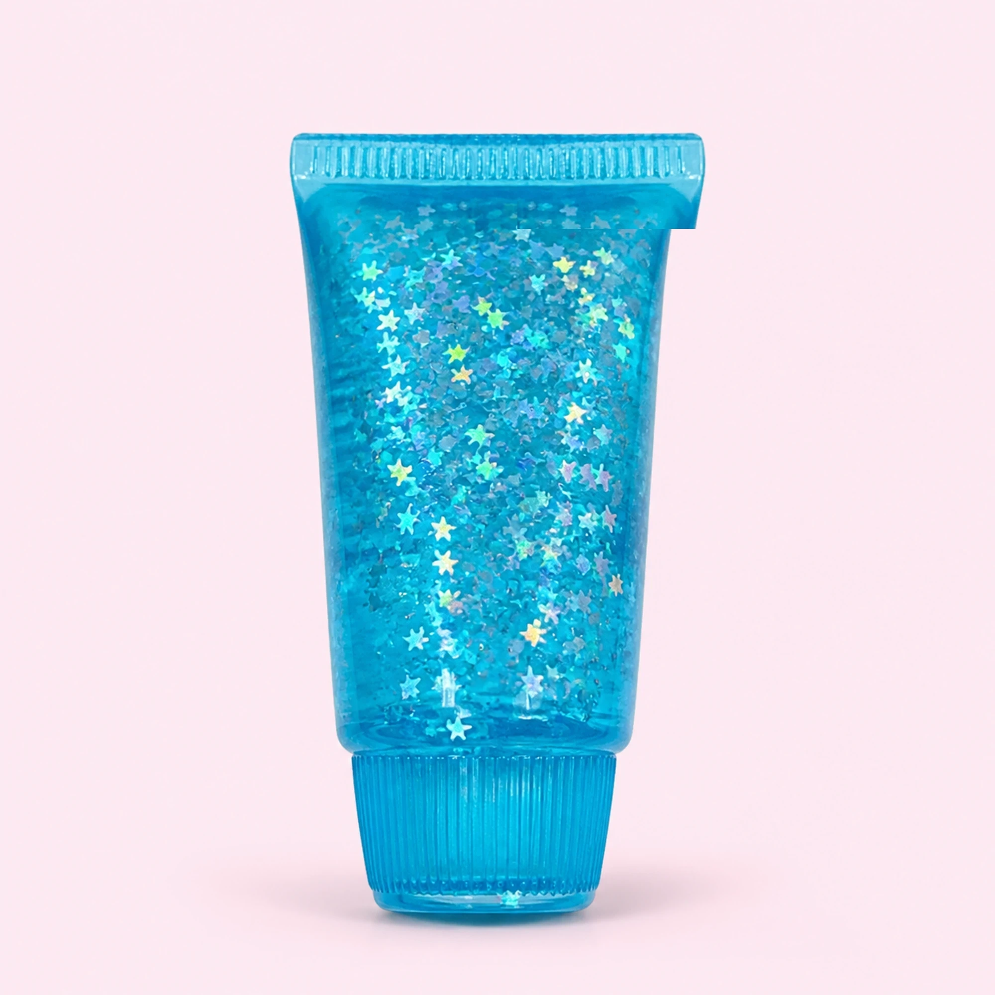 Blue glitter toothpaste squishy on a pale pink background