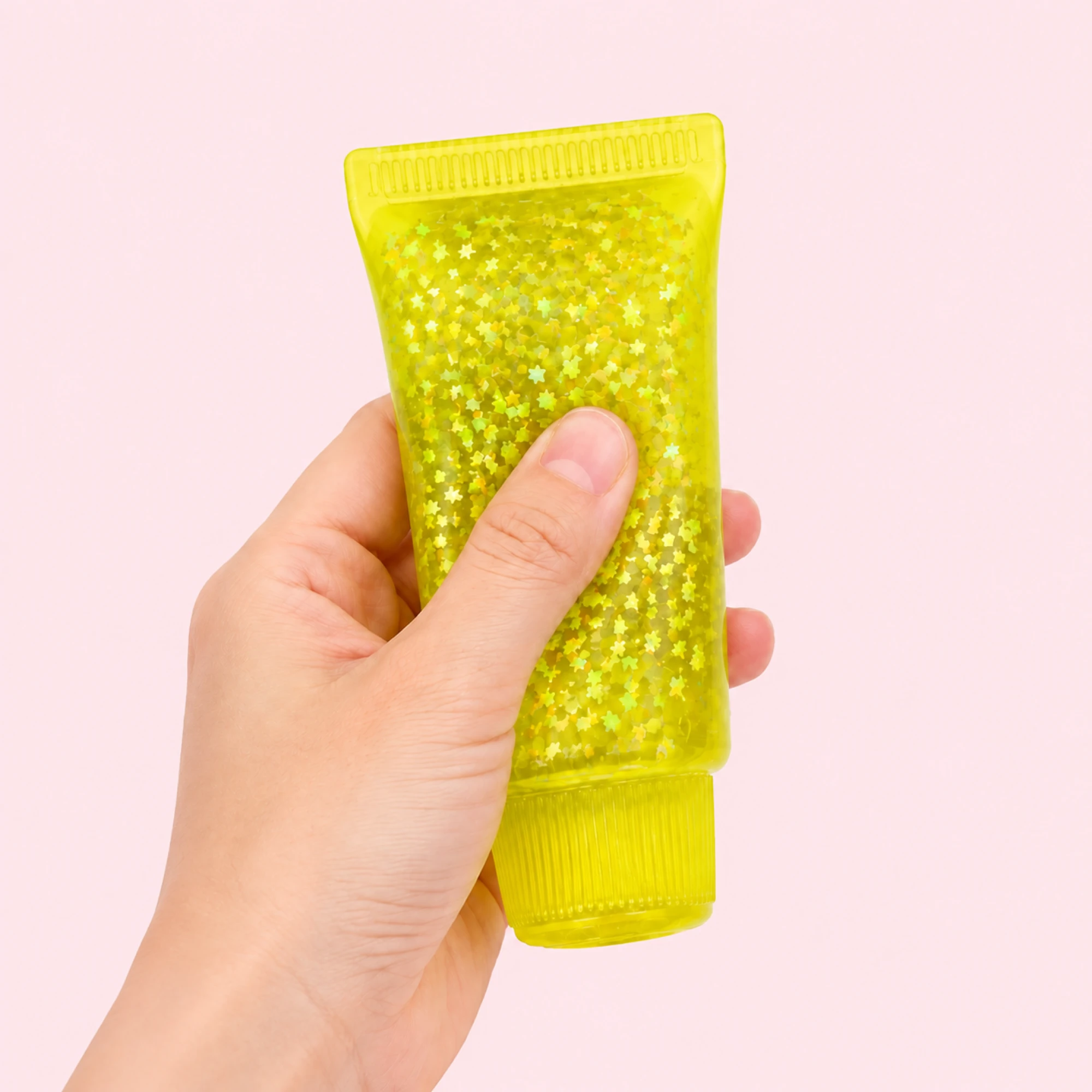 Glitter toothpaste squishy fluorescent-yellow - pink-background main image